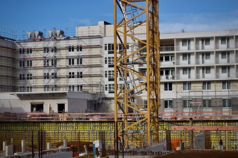 Building under construction with tower crane