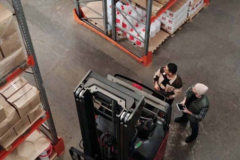 Warehouse team managing stock between racks